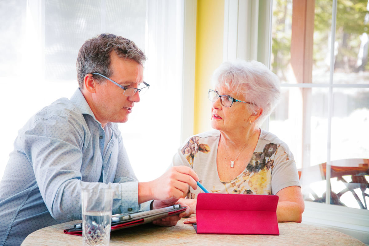 Adult children helping their senior parents with daily tasks.